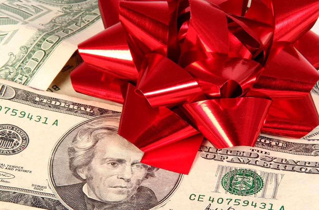 6 Holiday Shopping Tips. Money with a bow.