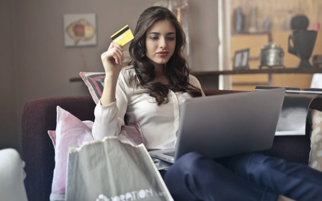 Woman using credit card to buy online